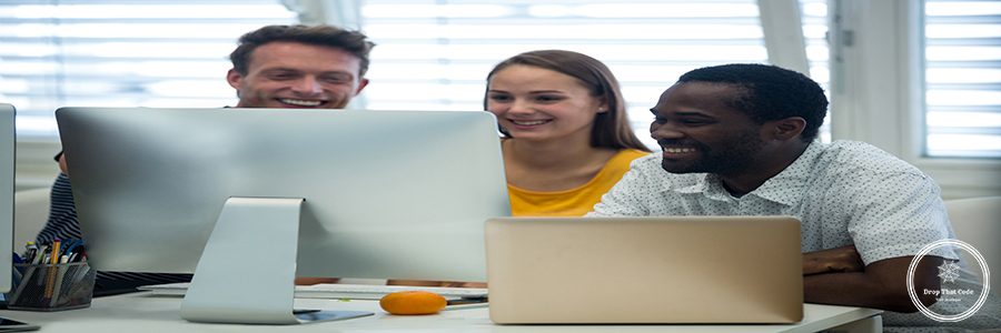 Male and female graphic designers interacting with each other in office