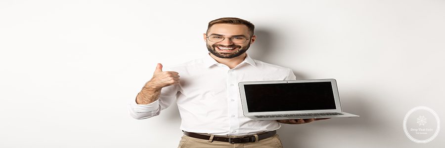Successful business man showing laptop screen, make thumb up in approval, praise something good, standing over white background.