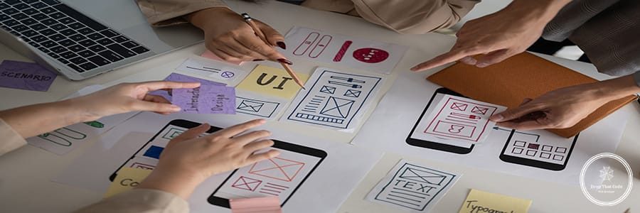 Top view image of a professional and creative UX UI graphic designer team voting a perfect prototype for their new product, discussing and planning work in the meeting.