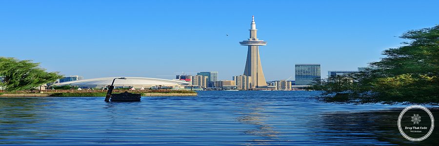 Toronto skyline in the day over lake with urban architecture viewed from park