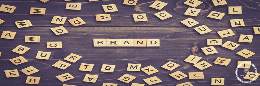 Brand word wood block on table for business concept.