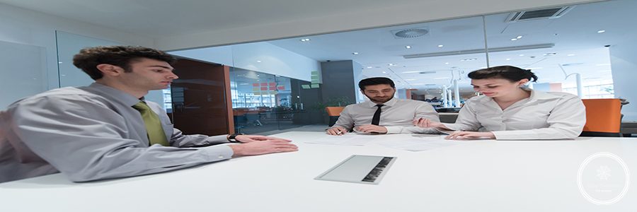 signing contract on partners back, young couple on business meeting with life insurance and bank loan agent at modern office interior