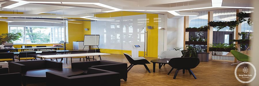 View of empty modern office with sofa, table, chair