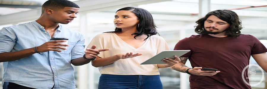 Walking, business people and tablet with team in office, planning and online research for startup. Collaboration, employees and digital with tech for information, discuss or prepare for presentation.