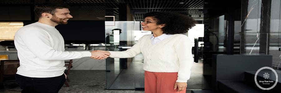 woman-giving-handshake-her-colleague-work