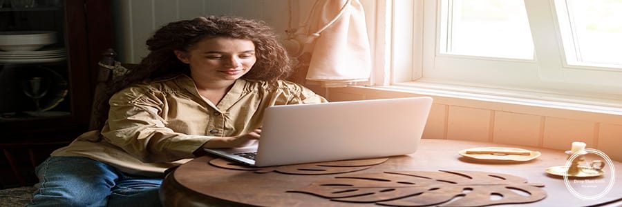woman-working-laptop-side-view