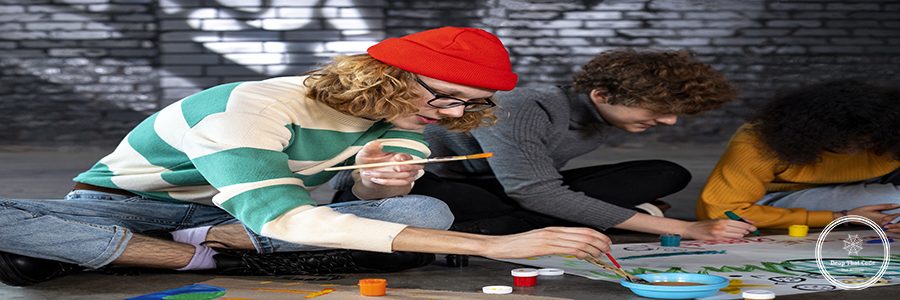 young-people-making-banners-together-full-shot